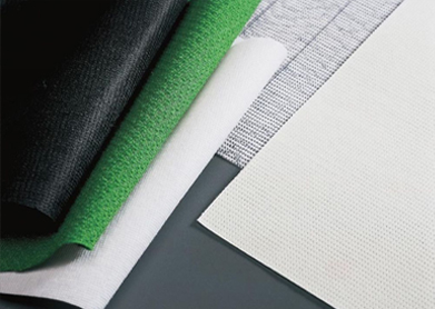 Features and aspects of stitch-bonded fabrics